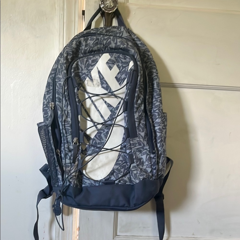 Nike Blue and Gray Backpack with Durable Fabric and Unique Design